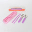 Pink cutlery set with case on a white background