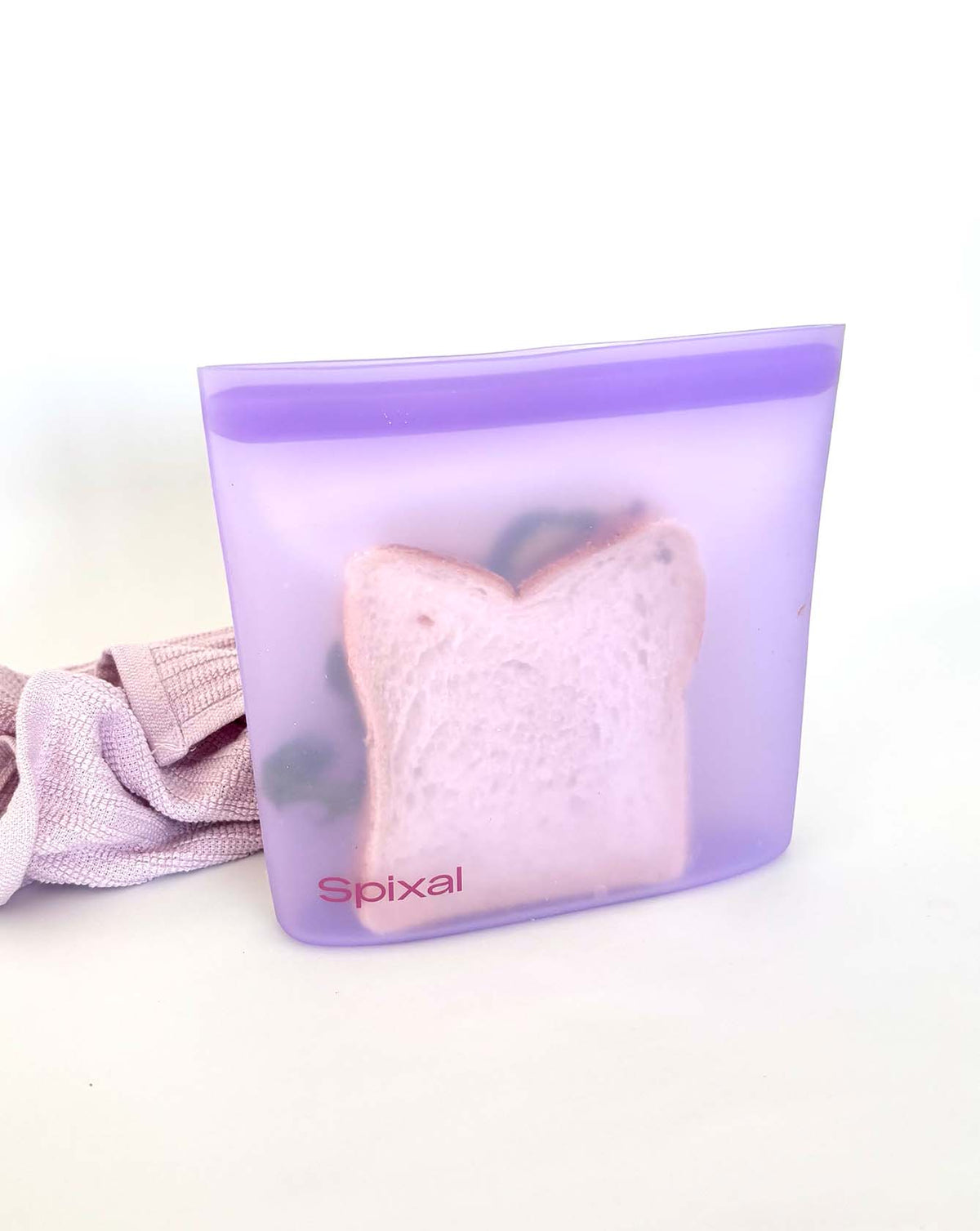 Purple silicone sandwich bag with a full sandwich inside.