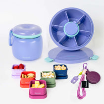 A set of Spixal lunch containers and accessories on a clean white background, including a purple insulated food jar with teal trim, a purple spinner lid, smaller colourful containers with food samples, a purple magnetic hat clip.