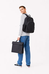 Large black Axis school bag and homework folder carried by teen school boy matching set library bag | Spixal