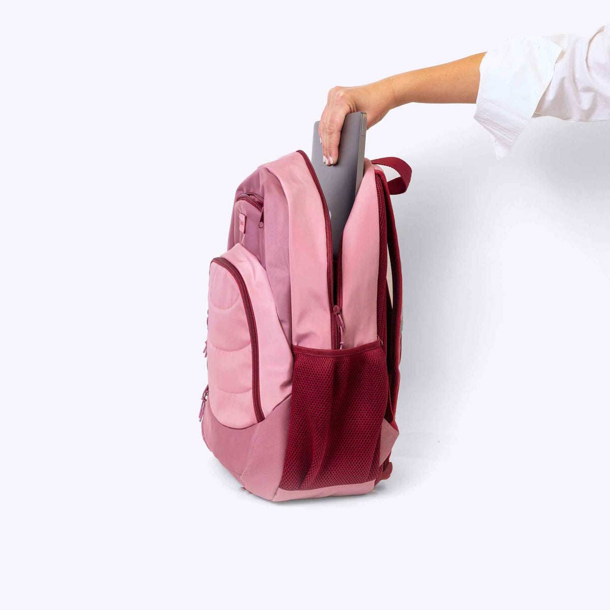 The Axis Backpack Pink — side view | Spixal