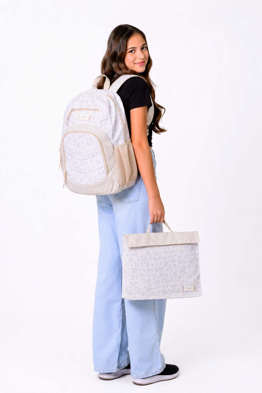 Large leopard print Axis school bag and homework folder carried by school girl matching set | Spixal