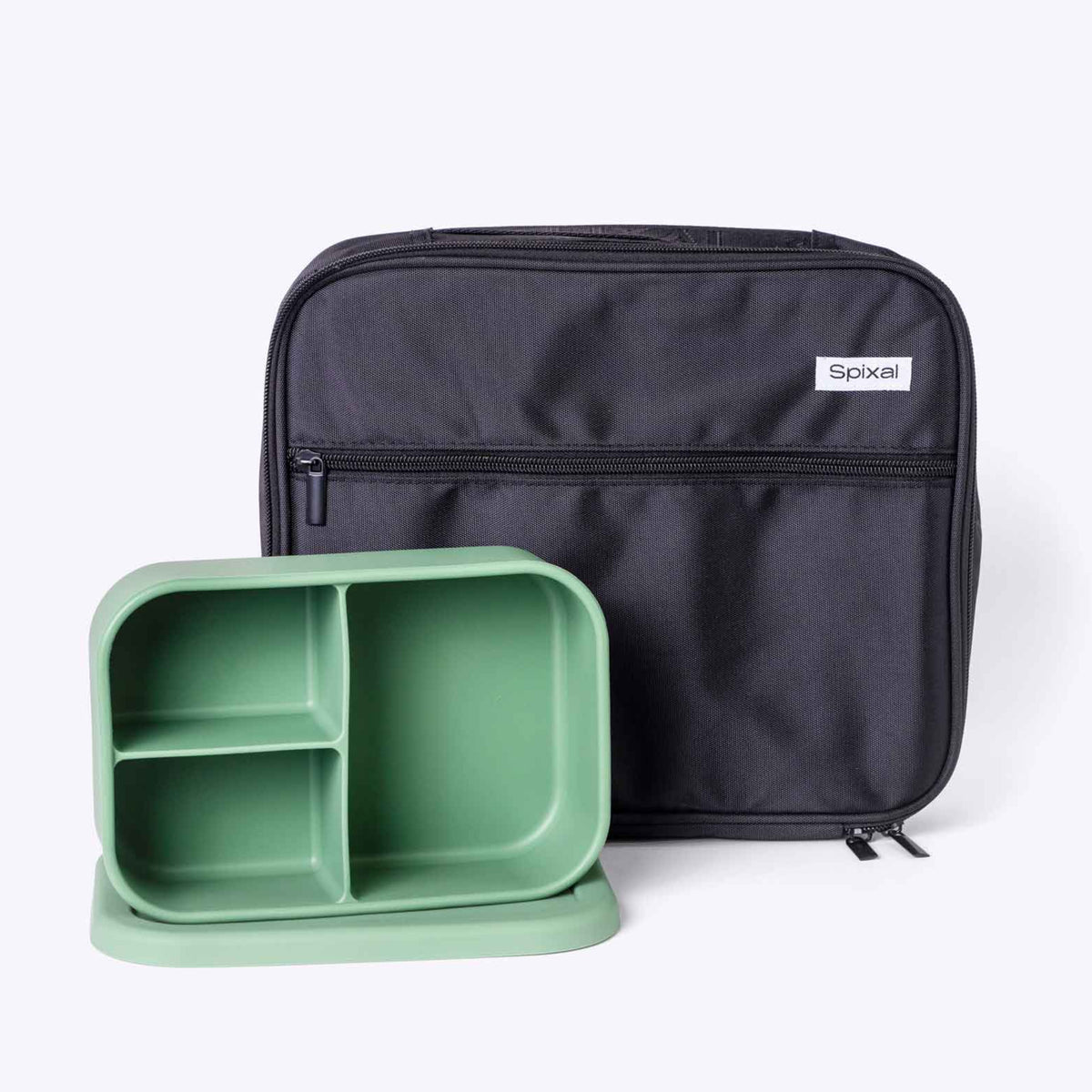 Black lunch bag and green bento box container on a white background Main image