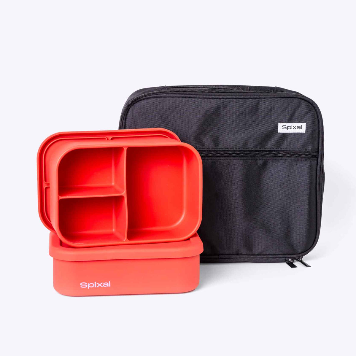 Red silicone lunch container with compartments and a black carrying case on a white background Main image