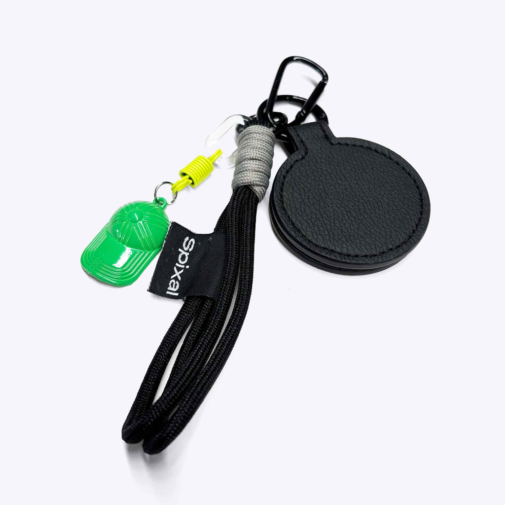 Black green magnetic hat clip attached to a school bag | Spixal | How to remember your school hat everyday