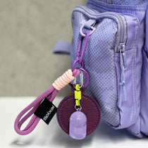 Purple magnetic hat clip attached to a school bag | Spixal | How to remember your school hat everyday