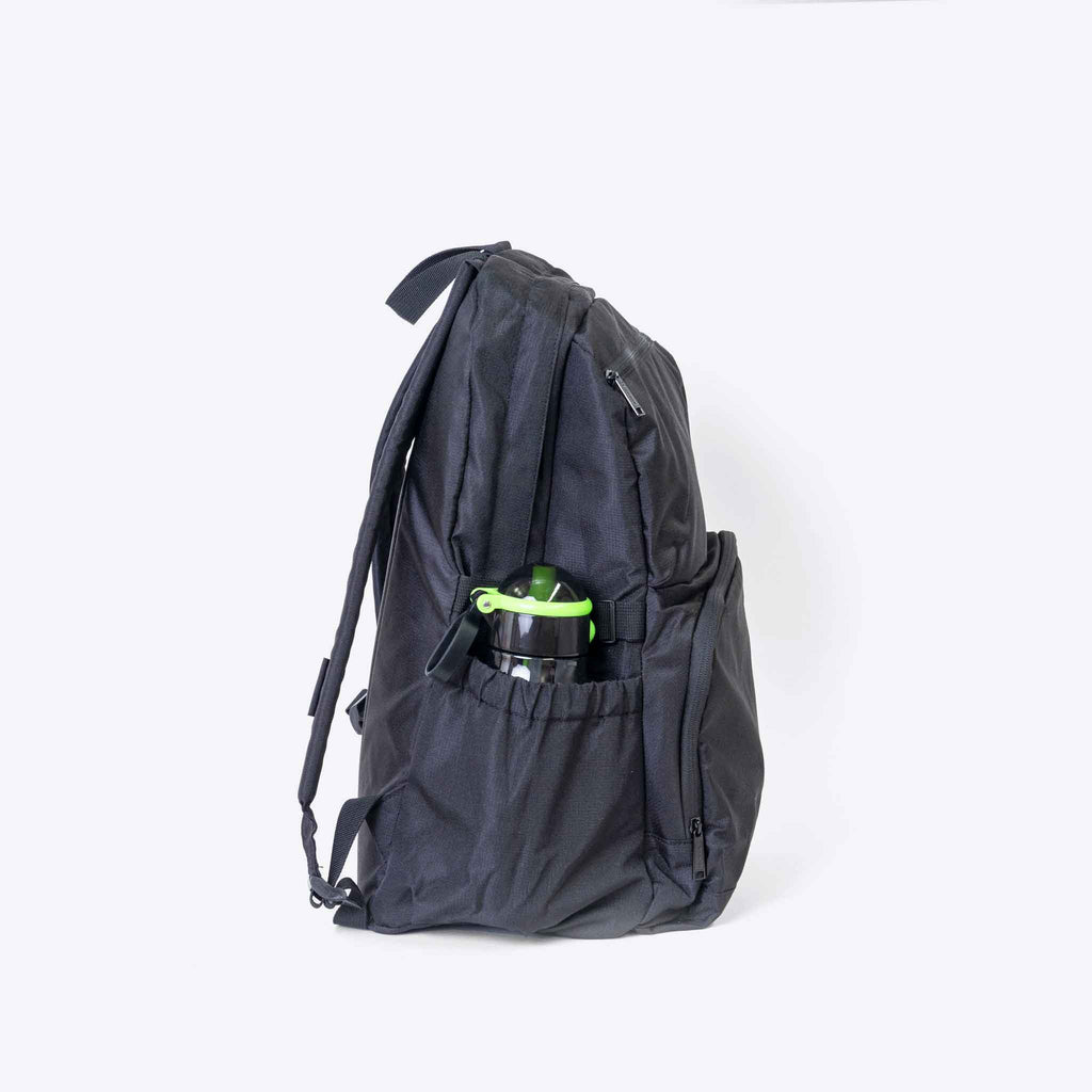 The Momentum Backpack — lifestyle flat lay | Spixal