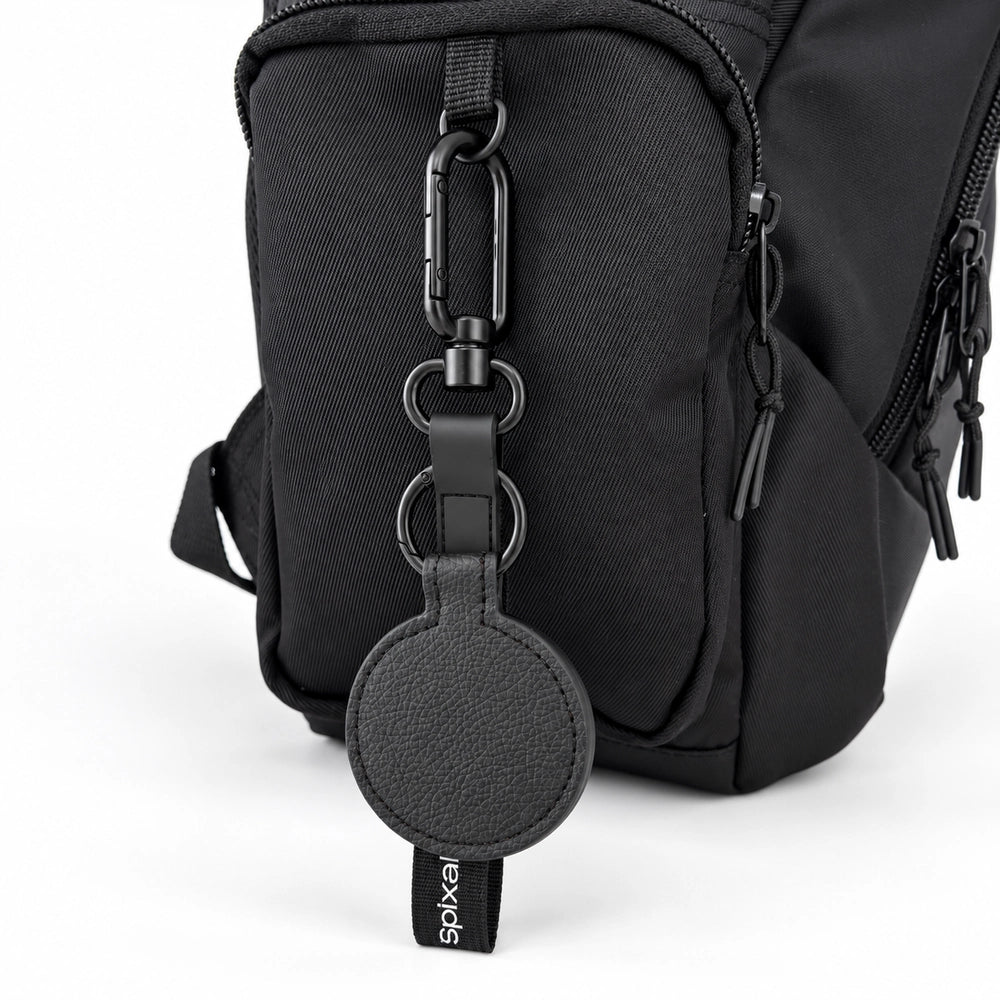 Black Axis magnetic hat clip for school bags, clipped to a black kids backpack | Spixal