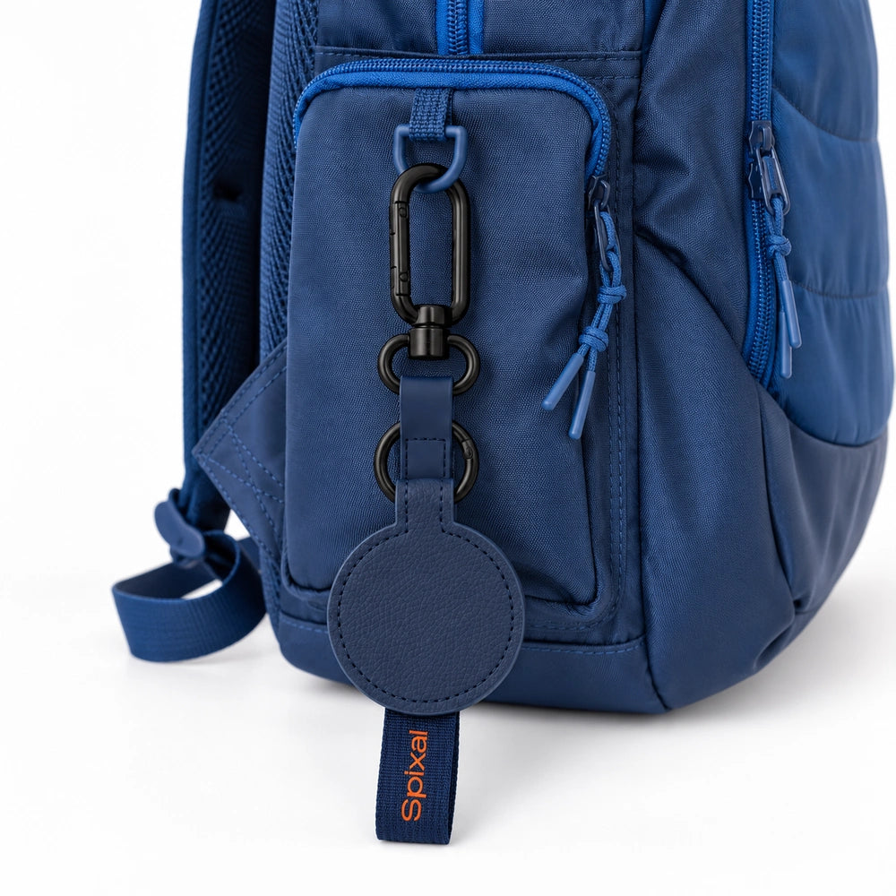 Navy blue Axis magnetic hat clip on a navy kids school backpack | Spixal