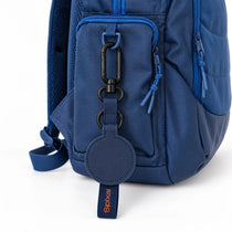Navy blue Axis magnetic hat clip on a navy kids school backpack | Spixal