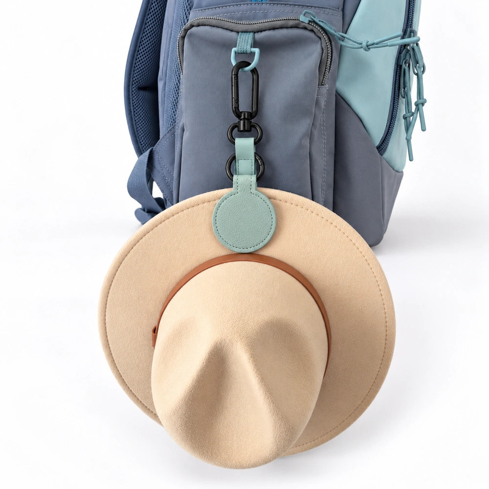Teal magnetic hat holder clip keeping a school hat on a kids backpack | Spixal