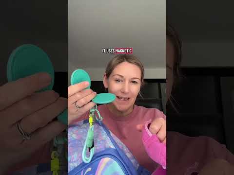 Magnetic hat clip video: clipping a school hat to a backpack